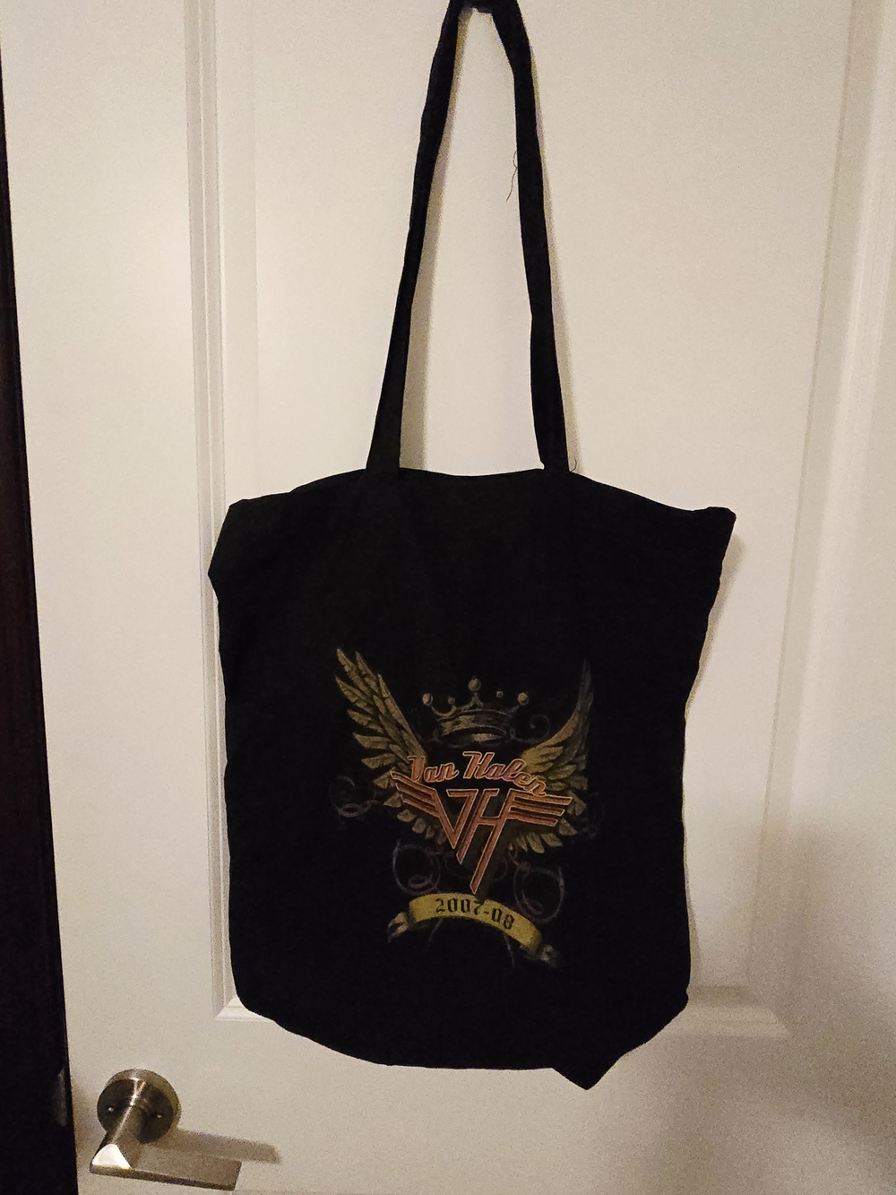 Black Graphic Tote Bag with Gold Accent Design